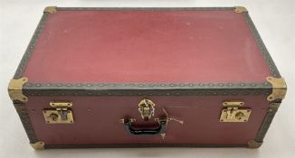 A Vintage red canvas and metal mounted travel trunk/case