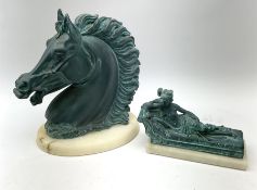 A composite figure modelled as a horses head with oxidised style finish