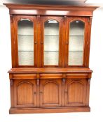 Waring & Gillow three door bookcase on cupboard