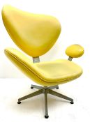 Retro style shaped chair upholstered in a yellow material