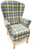 Wingback armchair upholstered in chequered fabric