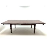 Victorian mahogany extending dining table with three leaves