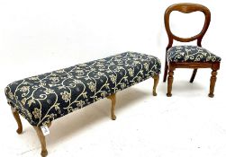 Rectangular footstool upholstered in a blue ground fabric with floral pattern