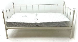 White metal day bed with mattress