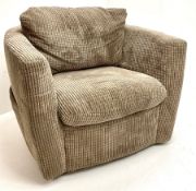 Swivel tub shaped armchair upholstered in jumbo cord fabric