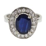 White gold oval sapphire and diamond cluster ring