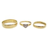 Two gold wedding rings and a gold single stone diamond ring