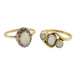 Gold three stone opal ring