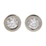 Pair of 18ct white and yellow gold round brilliant cut diamond stud earrings