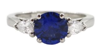 Platinum round Ceylon sapphire and pear shaped diamond three stone ring