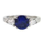 Platinum round Ceylon sapphire and pear shaped diamond three stone ring