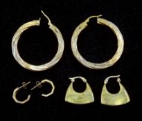 Pair of gold hoop earrings and two other pairs of gold earrings