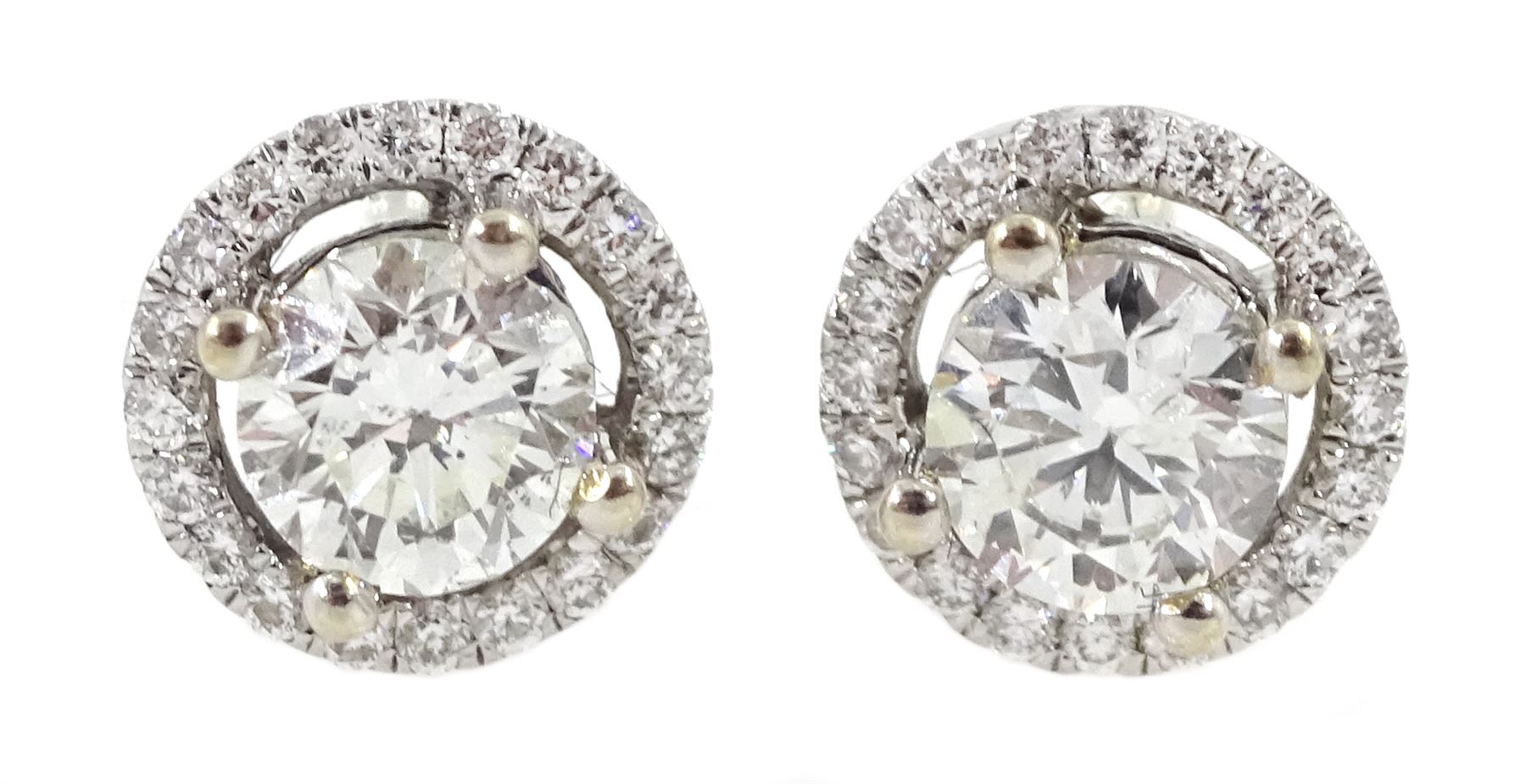 Pair of 18ct white gold round brilliant cut diamond halo stud earrings