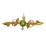 Edwardian gold peridot and split seed pearl bar brooch stamped 15ct