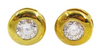 Pair of 18ct gold diamond rubover set earrings