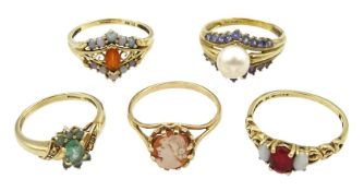 Five 9ct gold stone set rings including pearl and tanzanite