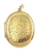 9ct gold oval locket with engraved flower decoration