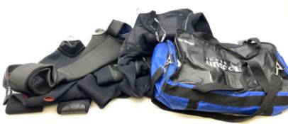 Collection of adult wet suits and diving equipment