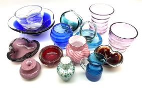 A group of coloured glassware comprising mostly Art Glass examples