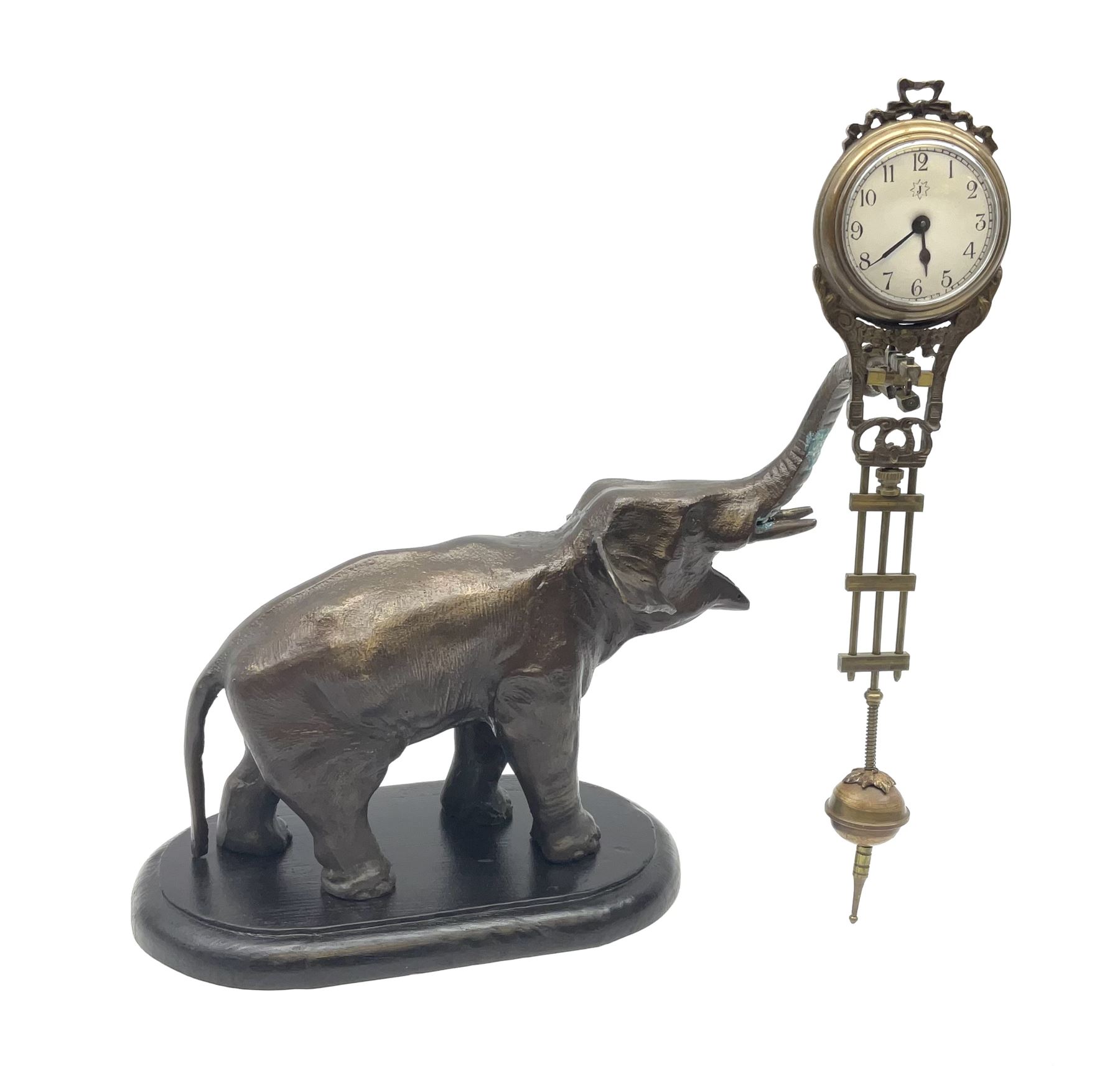 A spelter mystery clock modelled as an elephant supporting the clock upon its trunk