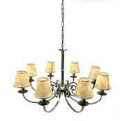 A large brushed effect eight branch chandelier