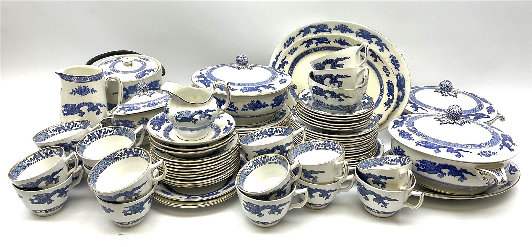 Booths and Cauldon matched tea and dinner wares decorated with blue dragons upon a plain ground heig
