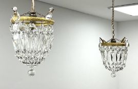 A pair of cut glass bag chandeliers with gilt metal mounts of clear glass drops