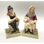 A pair of Staffordshire figures