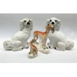A pair of Victorian Staffordshire white glazed spaniels