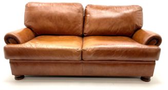 Three seat studded tan leather sofa