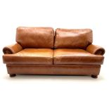 Three seat studded tan leather sofa