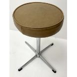 1970s stall with circular vinyl seat