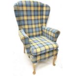 Wingback armchair upholstered in chequered fabric