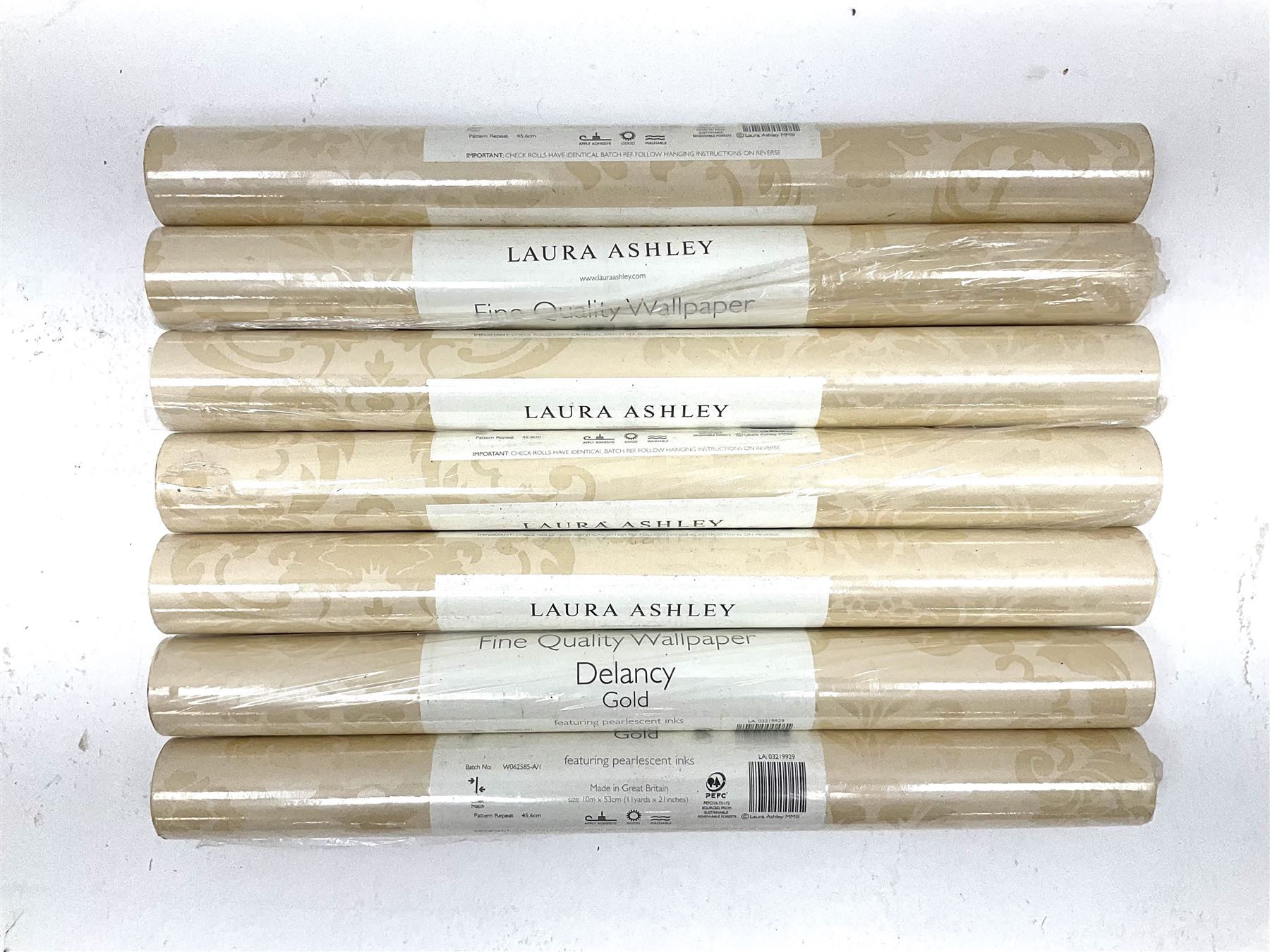 Seven rolls of Laura Ashley Delaney Gold wallpaper (W10m