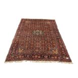 Persian Sarouk red ground rug