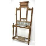 Edwardian walnut hallstand with centre mirror and tiled back