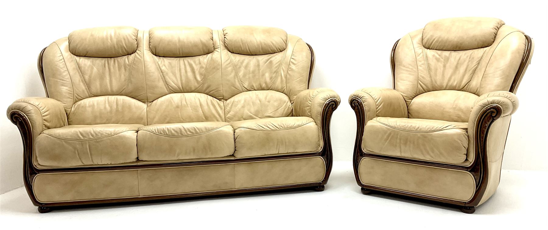 Three seat sofa upholstered in a cream leather (W178cm) and matching armchair (W85cm)