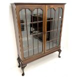 Early 20th century display cabinet enclosed by two astragal glazed doors