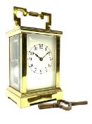 Early 20th century brass and bevelled glass carriage clock