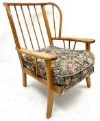 Mid century beech framed spindle back easy chair