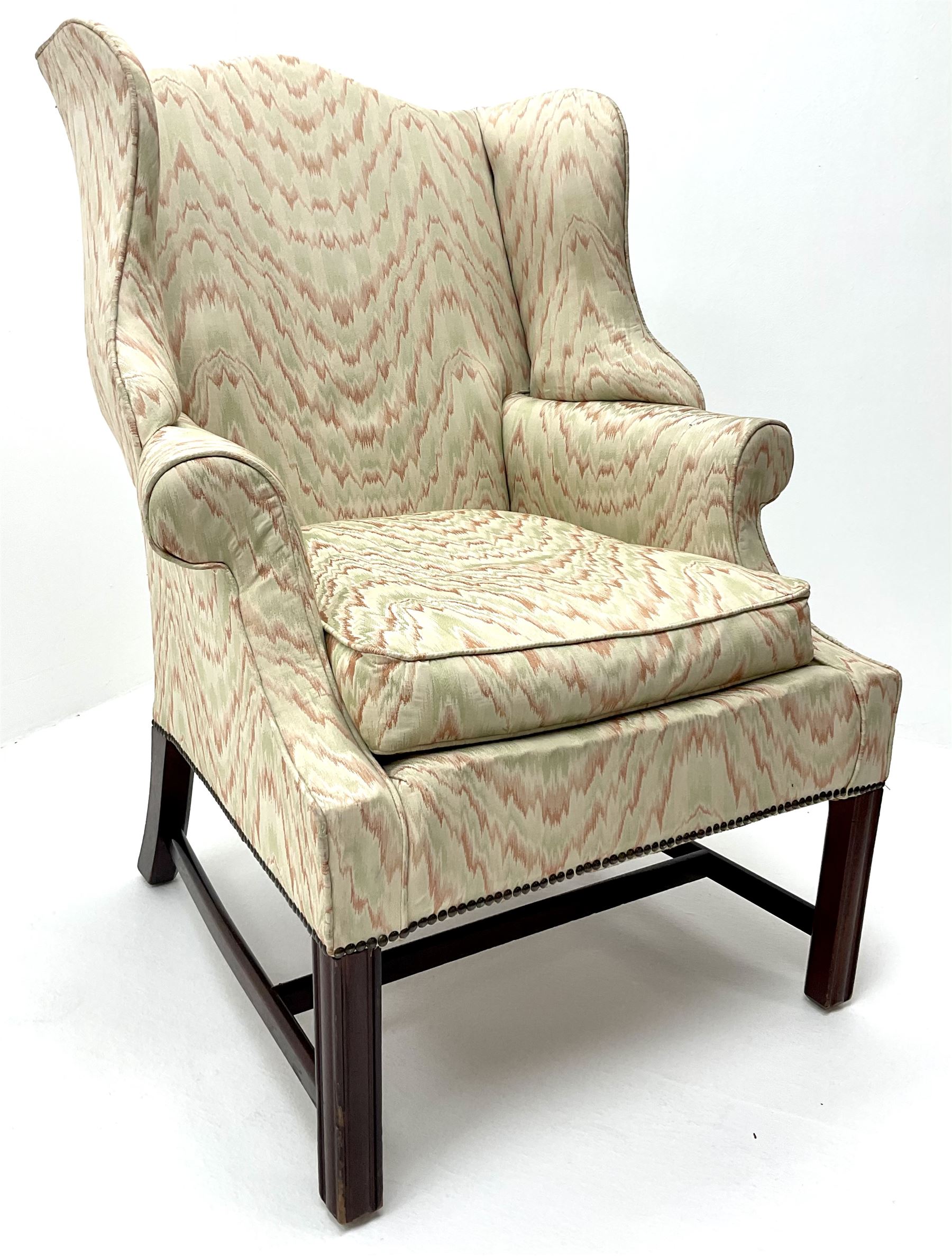 Georgian style mahogany framed wingback armchair upholstered in a beige ground fabric - Image 2 of 4