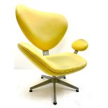 Retro style shaped chair upholstered in a yellow material