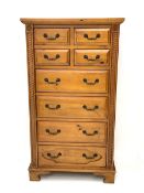 Gothic pine chest fitted with four short and four long drawers