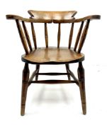 Early 20th century elm smokers bow armchair