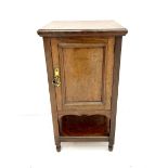 Edwardian oak bedside pot cupboard enclosed by panelled door