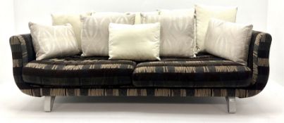 Grande four seat sofa upholstered in patterned fabric with contrasting scatter cushions