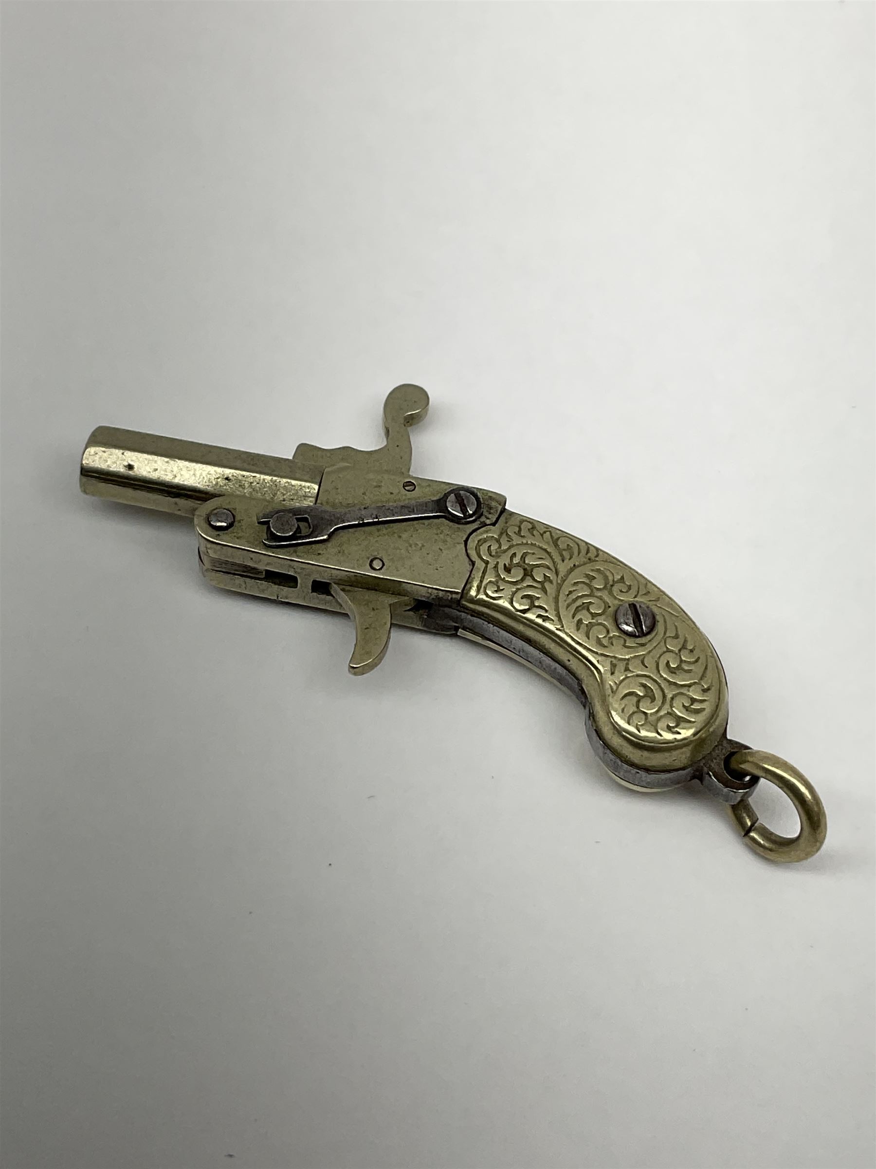 Miniature all nickel .22 pin fire single shot pistol with engraved grip and suspension ring to the b - Image 5 of 5