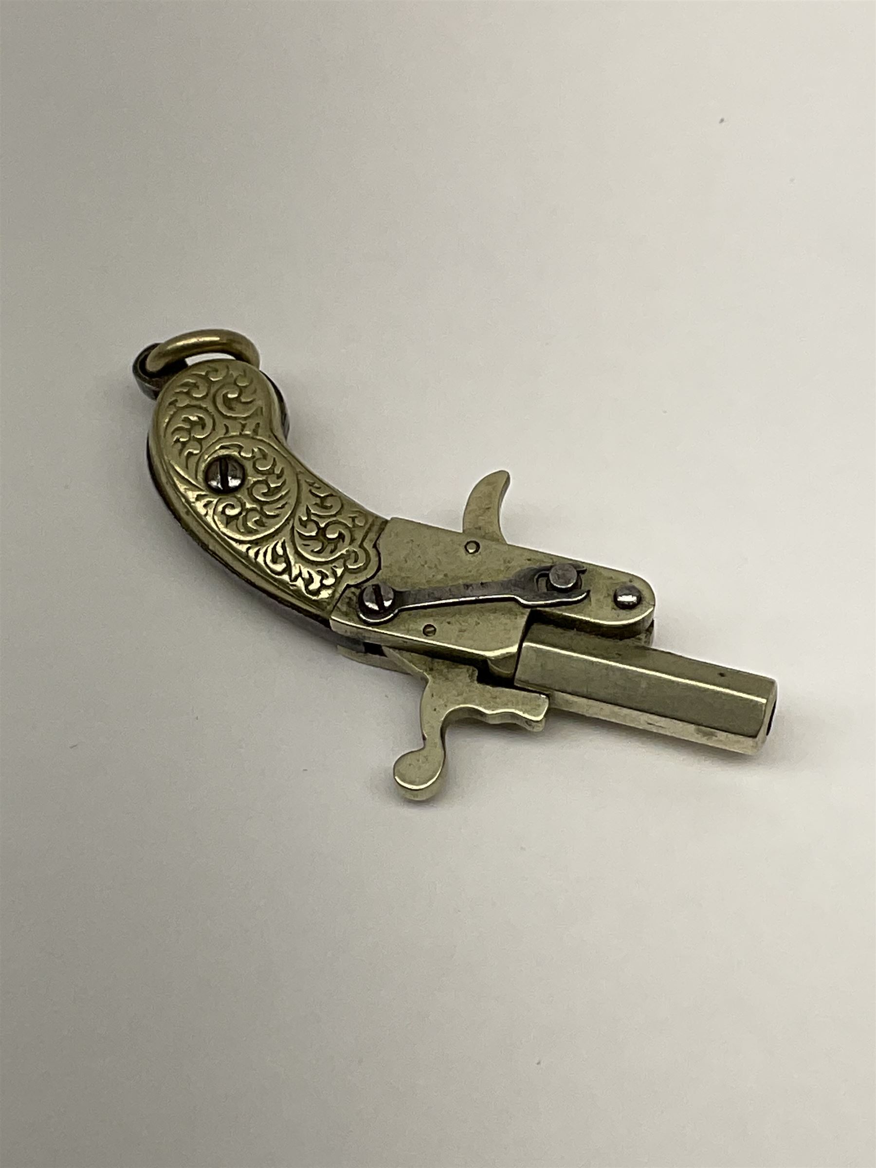 Miniature all nickel .22 pin fire single shot pistol with engraved grip and suspension ring to the b - Image 4 of 5