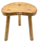 'Mouseman' oak three legged stool with dished kidney shaped seat