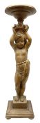 Italian carved lime wood torchère, the column modelled as a putto with arms raised supporting a